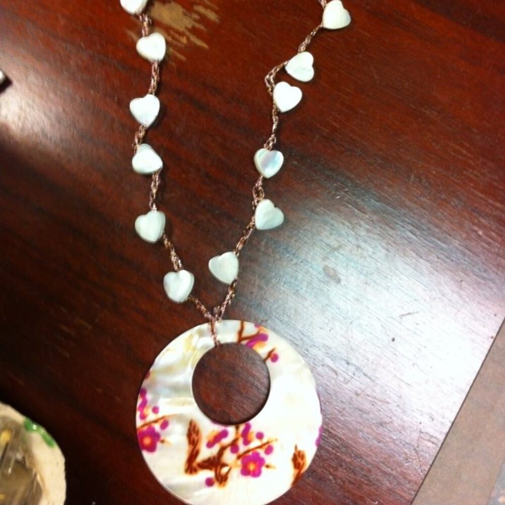 Hand crocheted necklace painted shell